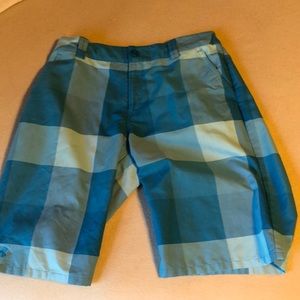 Checkered blue shorts (under armor). YXL
